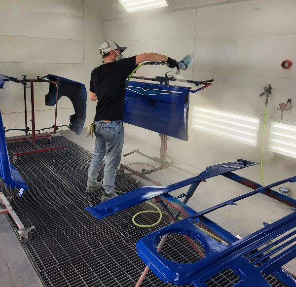 Auto Paint Technician at One Twenty-Two Collision painting vehicle parts Auto Paint Technician at One Twenty-Two Collision painting vehicle parts